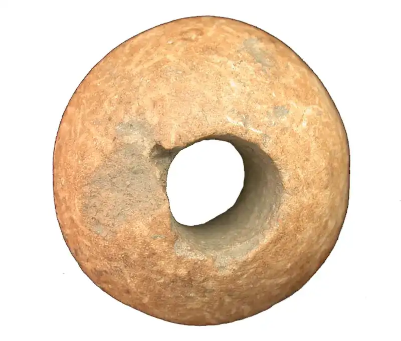 Celtic clay spindle whorl; 1st century BCE; central perforation