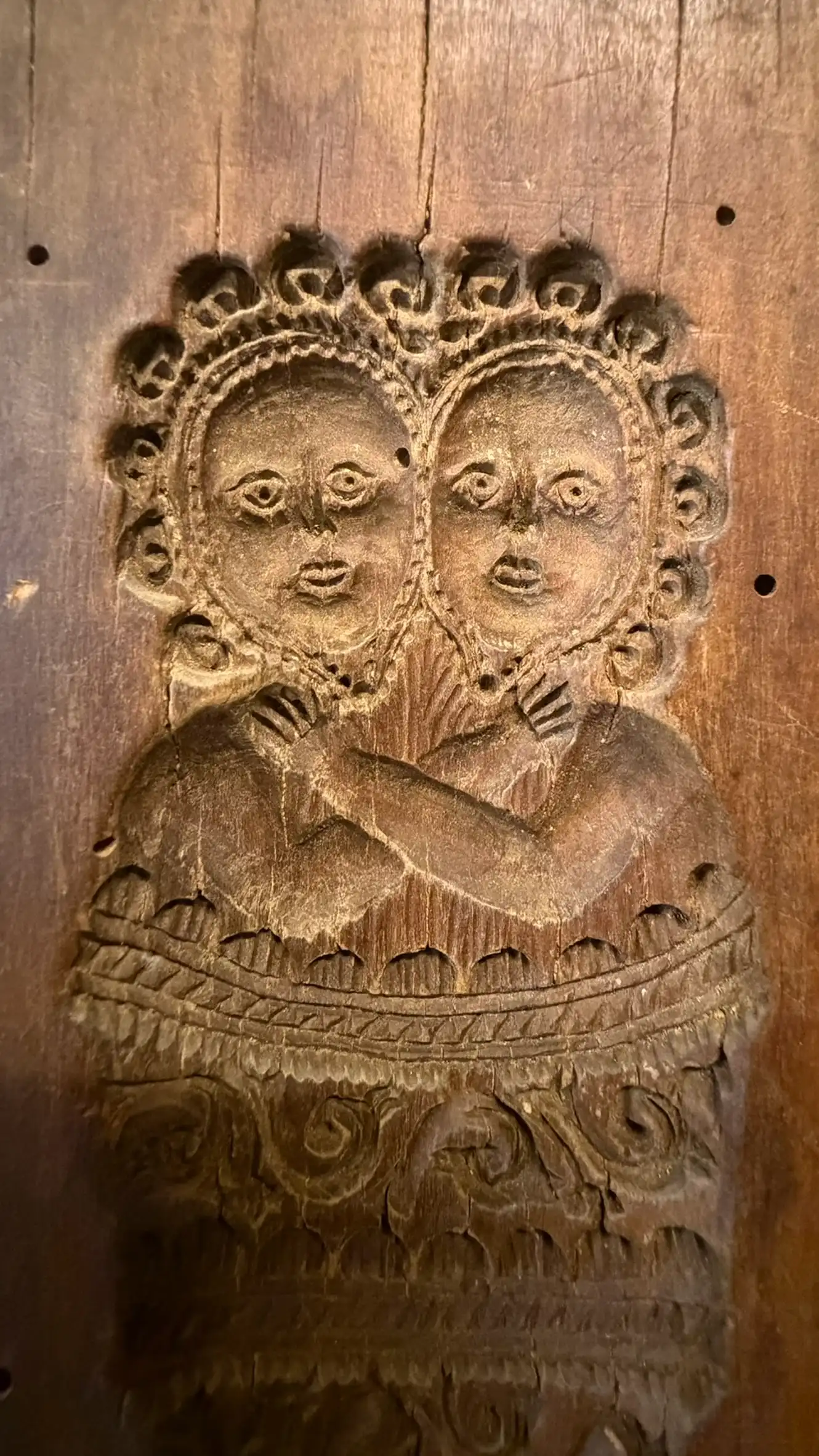 Wooden mould with carved double figure motif