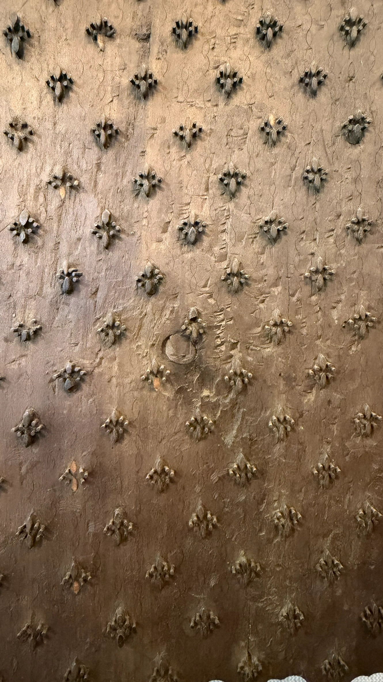 Wooden textile printing mould with small repeating floral motifs