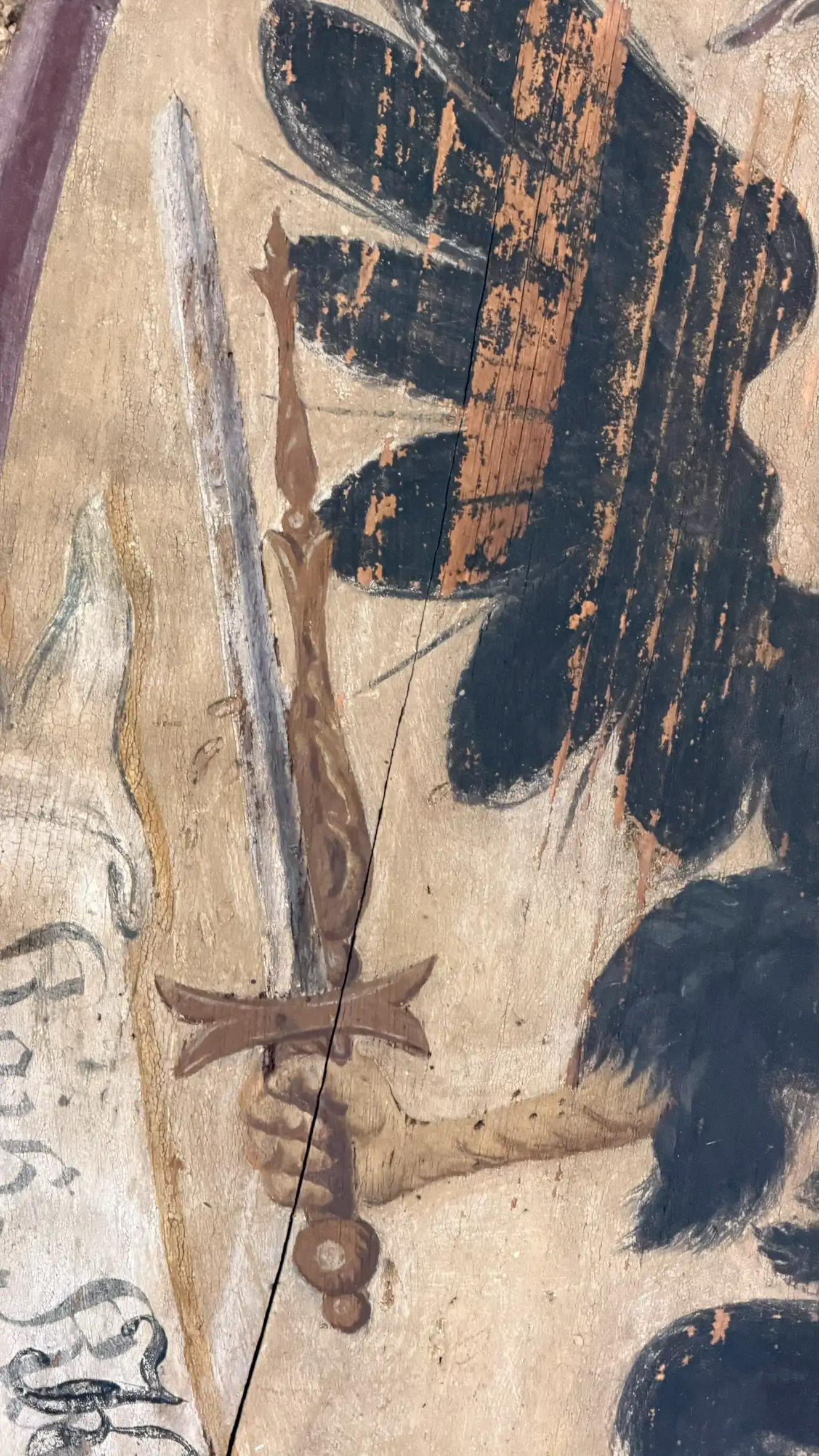 The Imperial Sword is depicted beside the eagle's wing.